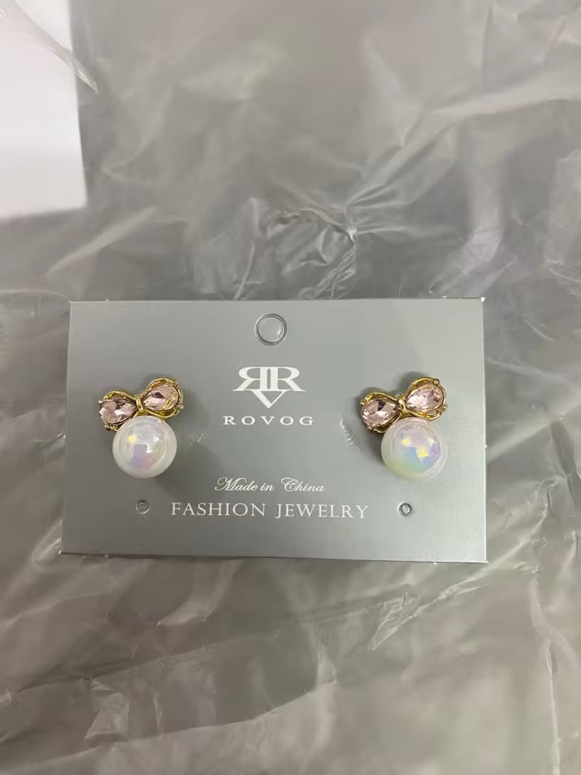 Pearl and crystal bow stud earrings in gold tone with iridescent pearl