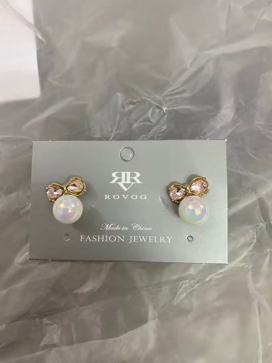 Pearl and crystal bow stud earrings in gold tone with iridescent pearl